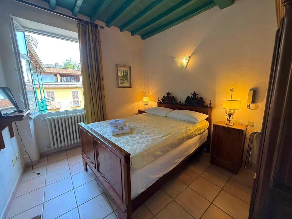 Postel nebo postele na pokoji v ubytování Albergo Dellangelo