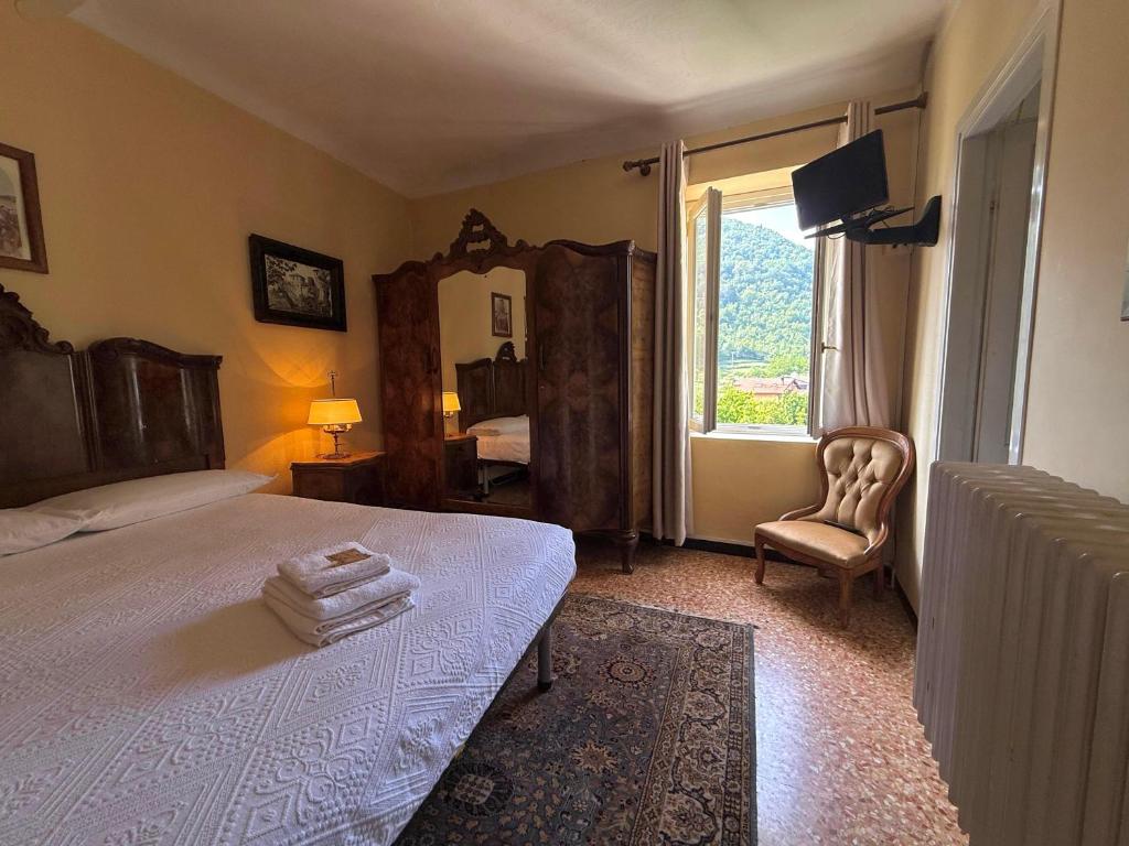 Postel nebo postele na pokoji v ubytování Albergo Dellangelo