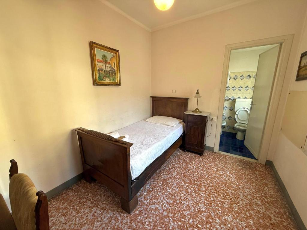 Postel nebo postele na pokoji v ubytování Albergo Dellangelo