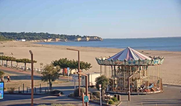 a roller coaster on a beach next to the ocean at Studio Saint Georges de Didonne in Saint-Georges-de-Didonne