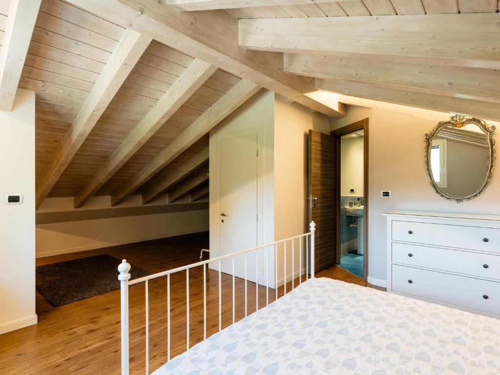 Łóżko lub łóżka w pokoju w obiekcie Apartment Casa Mimosa by Interhome