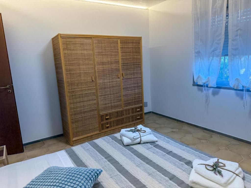 Postel nebo postele na pokoji v ubytování Yurta Glamping San Leone & Casa Vacanza Baia Blu