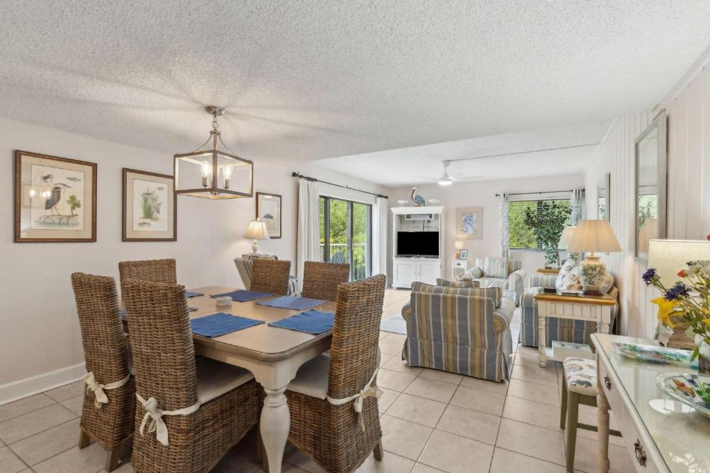 a dining room and living room with a table and chairs at 2034 Beachwood in Fernandina Beach