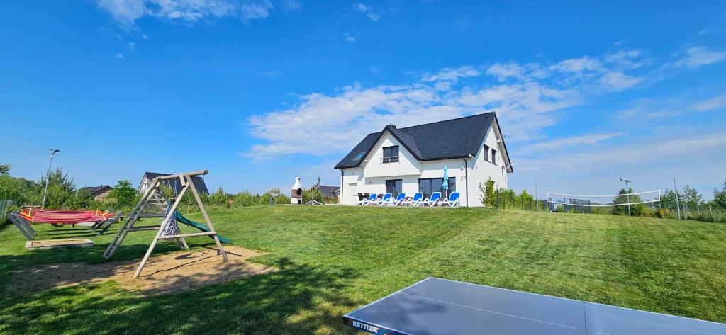 Zahrada ubytování Villa Koprowo - mit direktem Seezugang, Sauna & Whirlpool