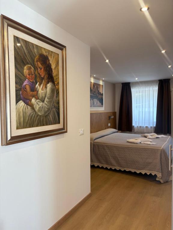 Postel nebo postele na pokoji v ubytování Albergo Vittoria