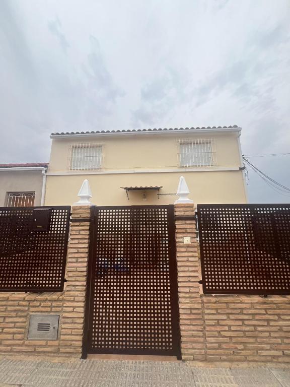 a building with a fence in front of it at La Casica Vieja in Albujón
