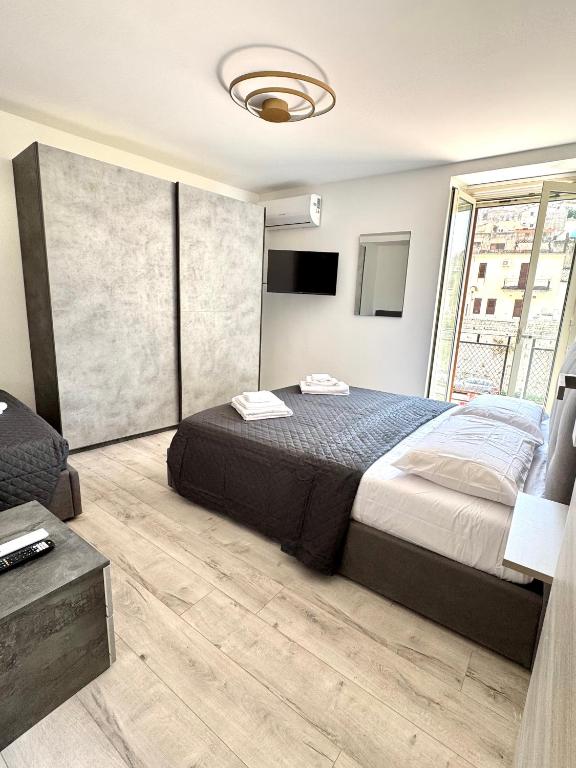 Llit o llits en una habitació de AL CUOR NON Si COMANDA