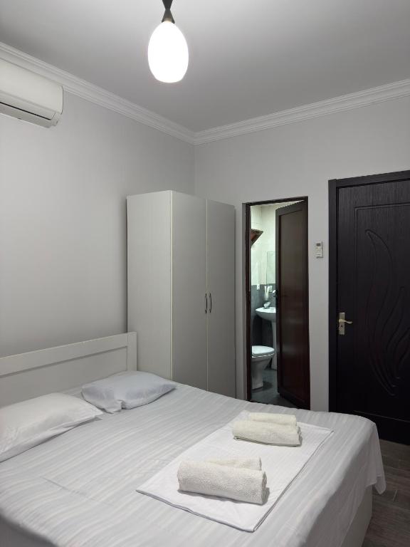 Postel nebo postele na pokoji v ubytování Lia Guest House