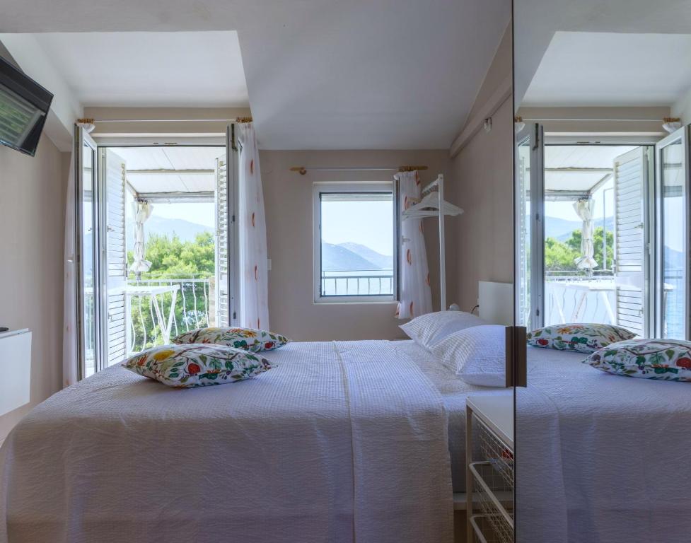 Postel nebo postele na pokoji v ubytování Apartmani Topolovec