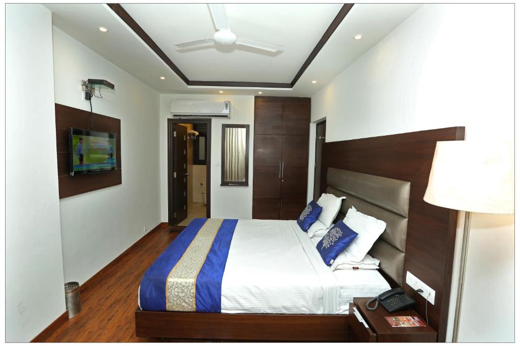 Postel nebo postele na pokoji v ubytování Airport Hotel The R Blues - New Delhi
