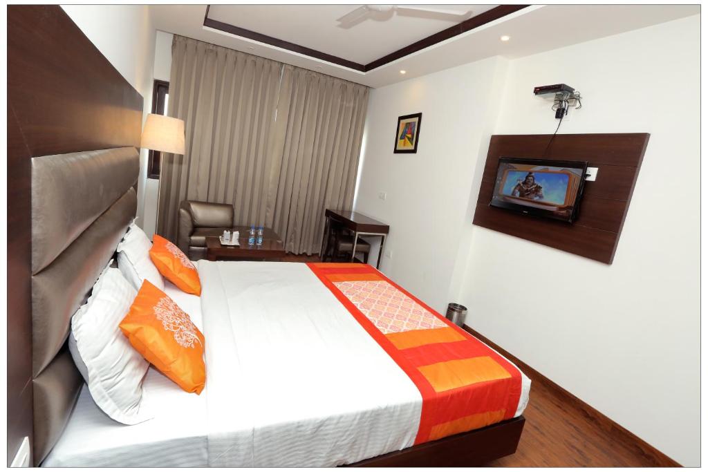 Postel nebo postele na pokoji v ubytování Airport Hotel The R Blues - New Delhi
