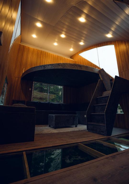 a lobby with a spiral staircase in a building at Azure Lagoon Resort 