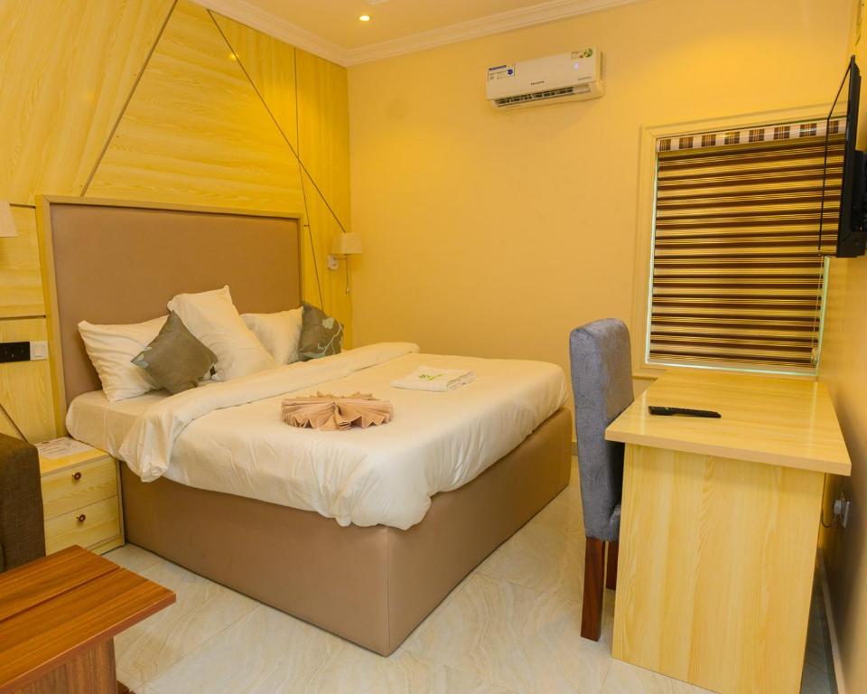 Voodi või voodid majutusasutuse Proximus Hotel and Suites toas