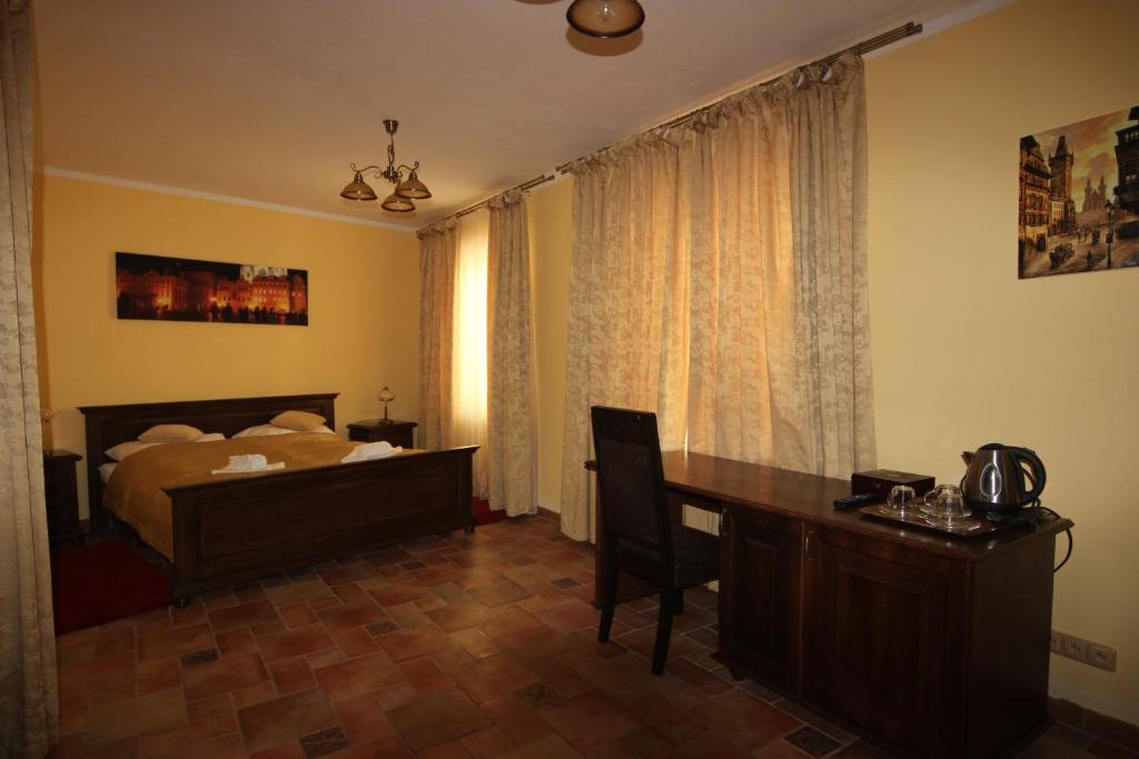 Postel nebo postele na pokoji v ubytování Hotel Pelikán