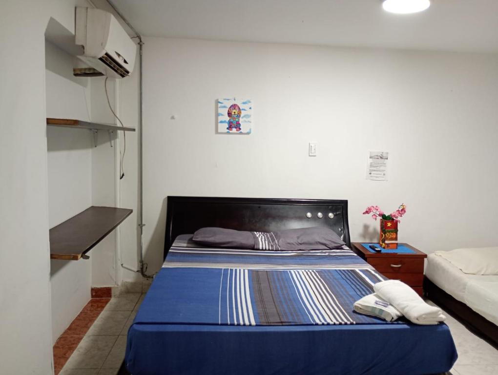 Postel nebo postele na pokoji v ubytování Hostal Casa Yare
