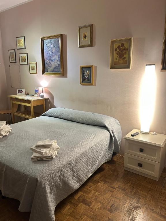 Postel nebo postele na pokoji v ubytování camera Santa Rita