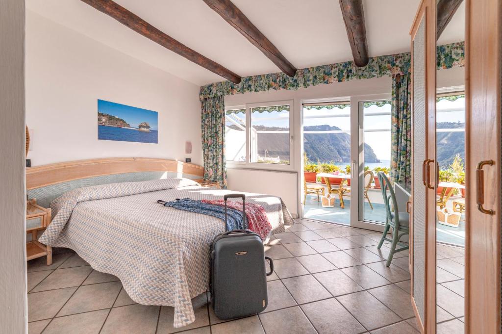 Postel nebo postele na pokoji v ubytování Hotel Casa del Sole