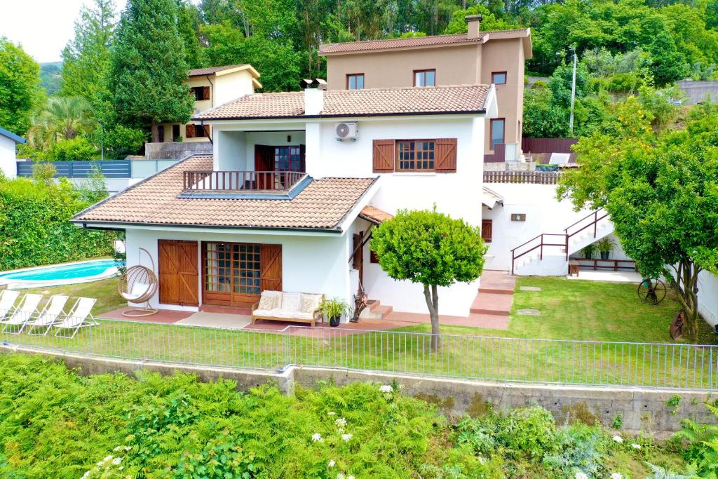a villa with a view of a house at Miradouro 13 - Gerês in Geres