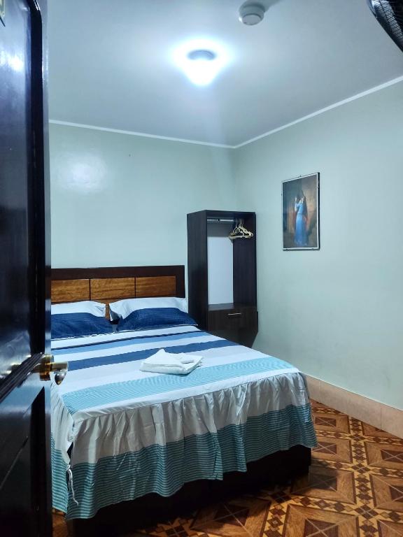 Postel nebo postele na pokoji v ubytování Hostal Leon Internacional