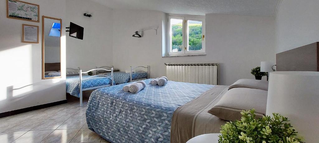 Postel nebo postele na pokoji v ubytování Le Cascate Bed and Breakfast