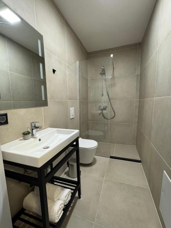 Koupelna v ubytování Fole Apart Hotel