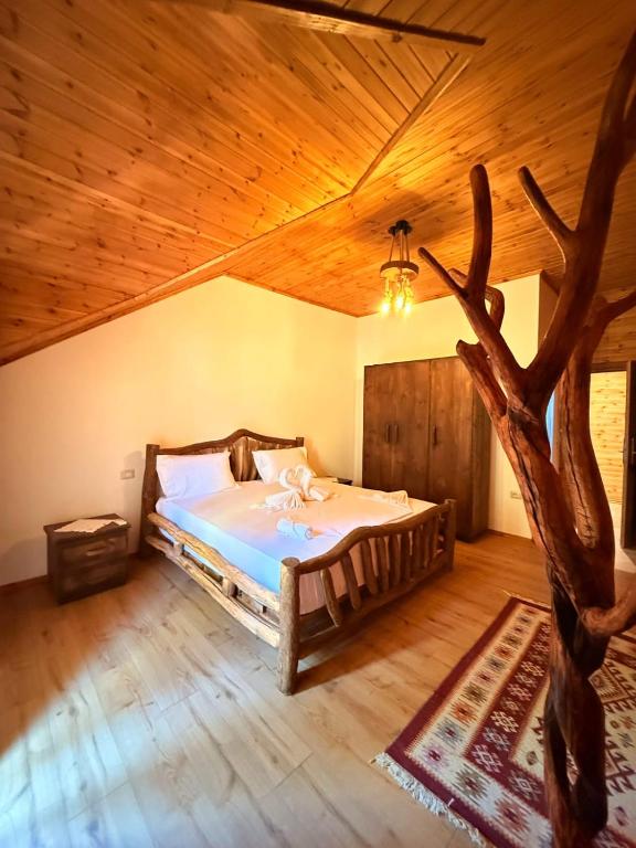 Postel nebo postele na pokoji v ubytování Bujtina Guri Hanit