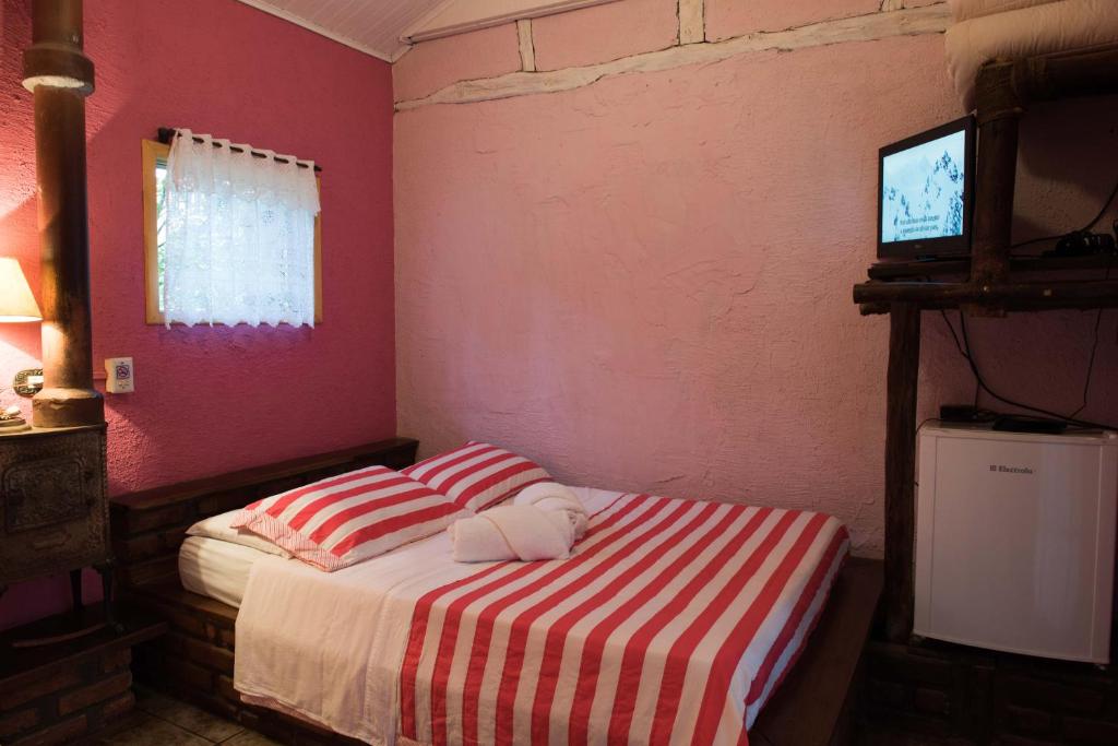Cama ou camas em um quarto em Pousada Janela do Céu