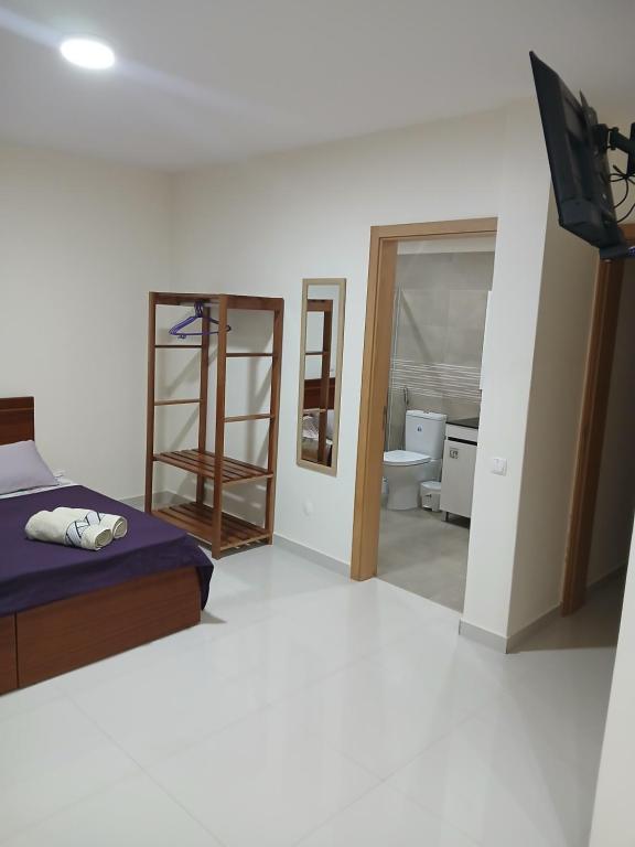 Postel nebo postele na pokoji v ubytování Nifa House
