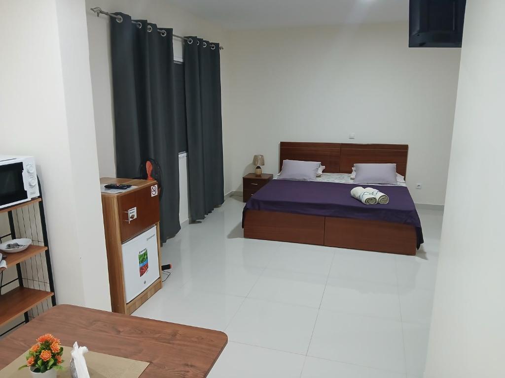 Postel nebo postele na pokoji v ubytování Nifa House