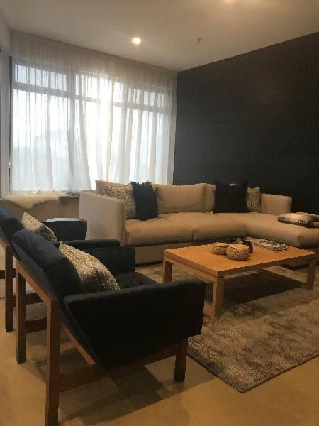 a living room with a couch and a table at Konayuki Penthouse 9 in Falls Creek