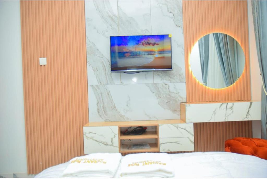 Postel nebo postele na pokoji v ubytování Radiant Rise Apartments