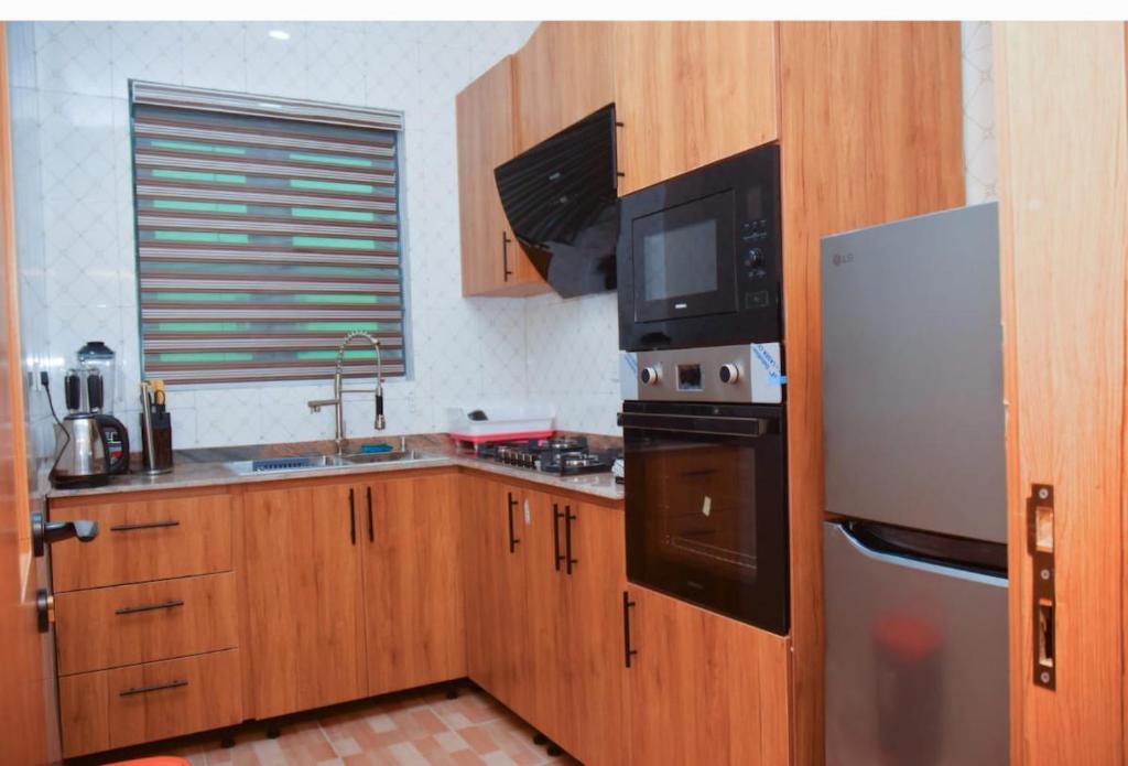 Kuchyň nebo kuchyňský kout v ubytování Radiant Rise Apartments