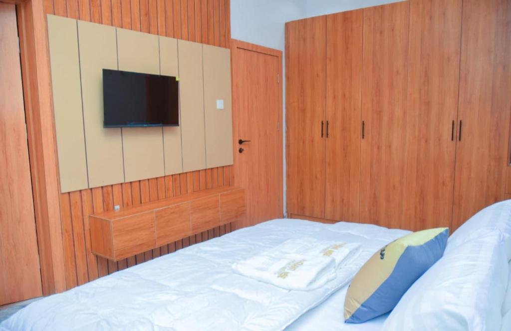 Postel nebo postele na pokoji v ubytování Radiant Rise Apartments