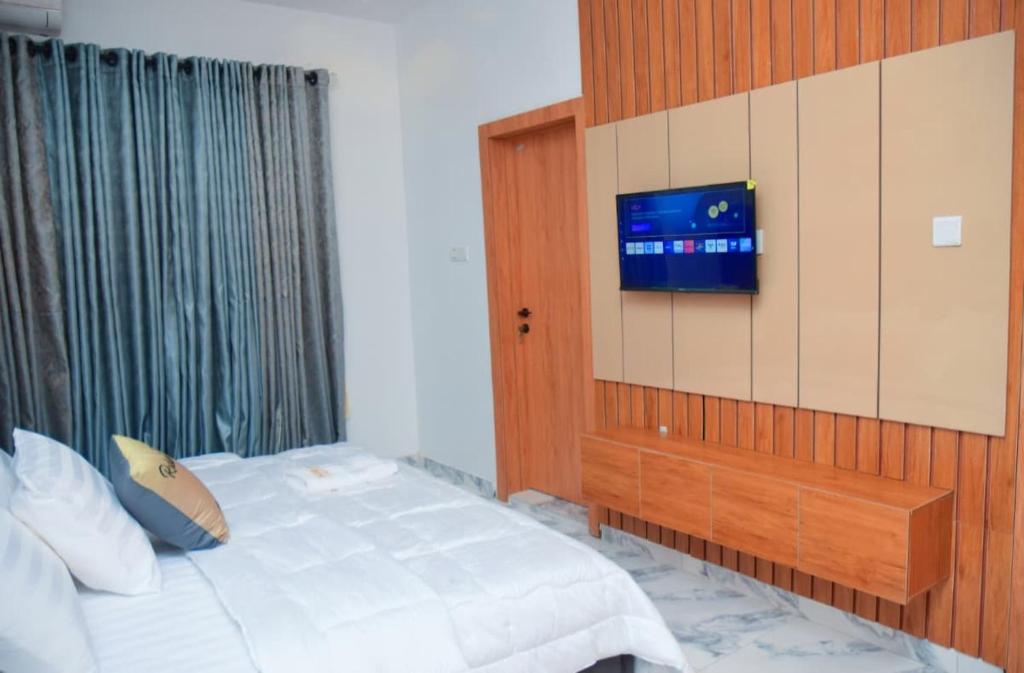 Postel nebo postele na pokoji v ubytování Radiant Rise Apartments