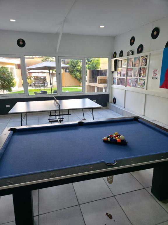 a billiard room with a blue pool table at Complejo Turístico Mendoza in Godoy Cruz