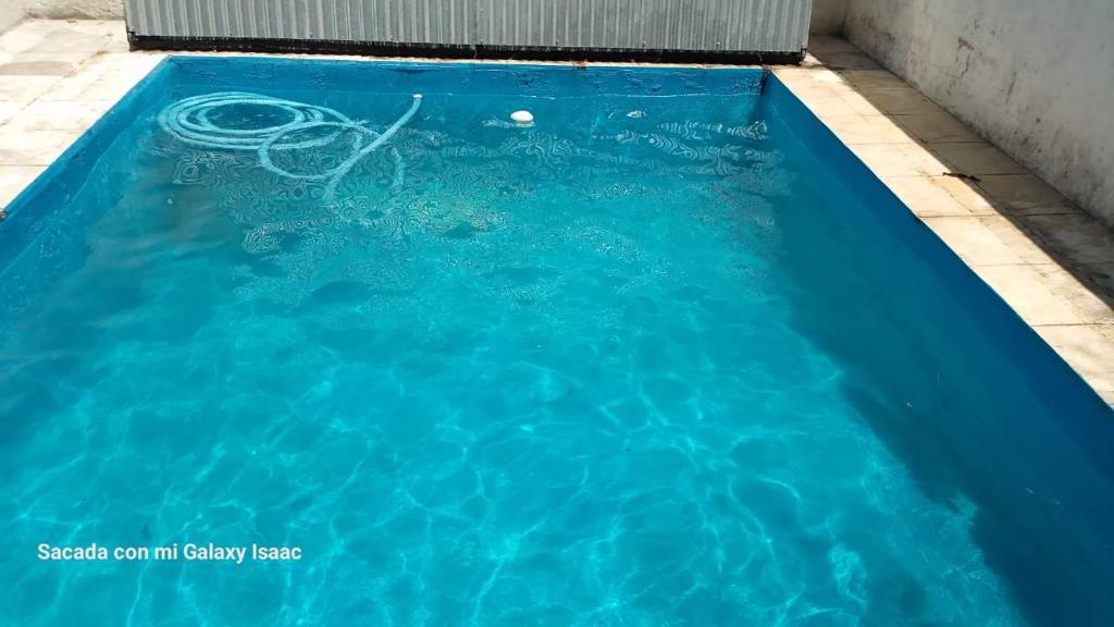 a swimming pool with a ball in the water at La Gregoria in Carpintería