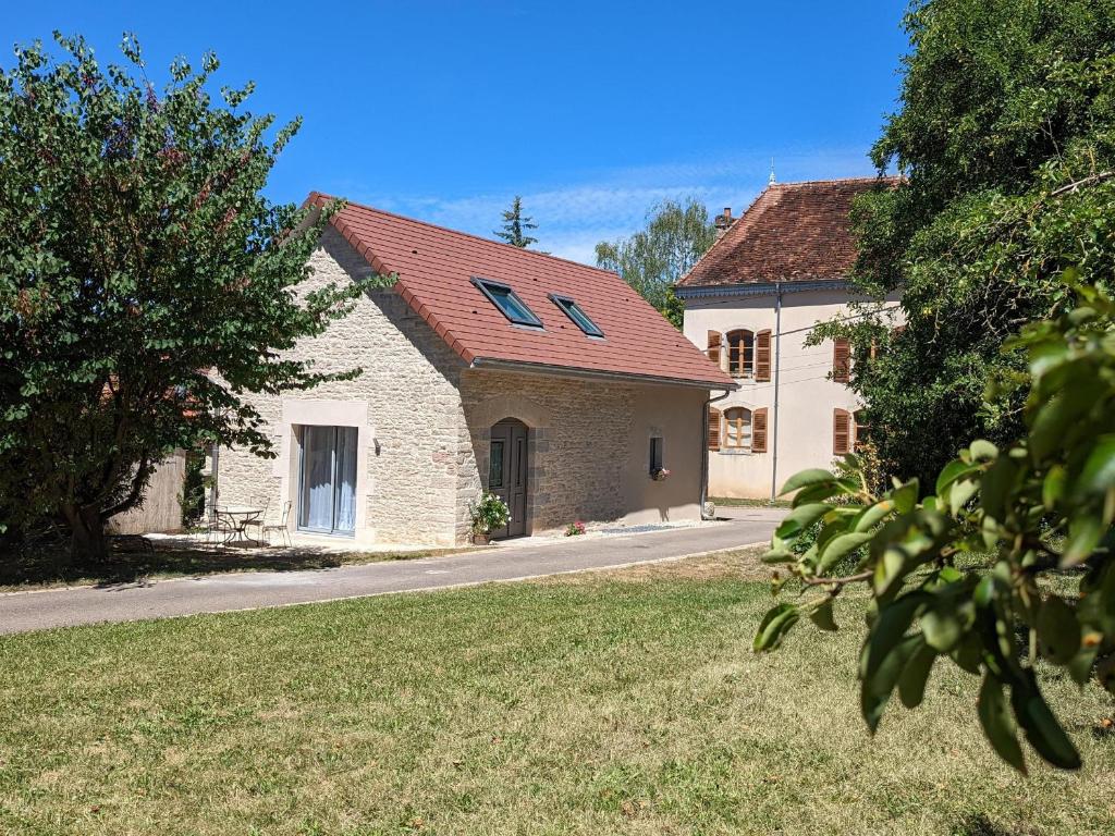 a white building with a red roof on a street at Charmant gîte indépendant avec jardin et activités familiales - FR-1-583-415 in Maizières
