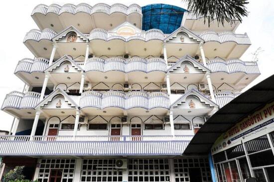 a large white building with a white balcony at Hotel Gangotri Pvt Ltd in Bharatpur