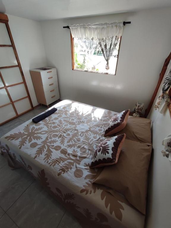 Postel nebo postele na pokoji v ubytování HAUHITI Lodge