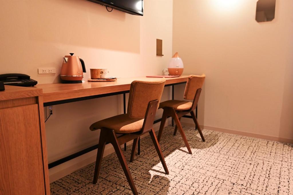 TV a/nebo společenská místnost v ubytování cinnamon hotel