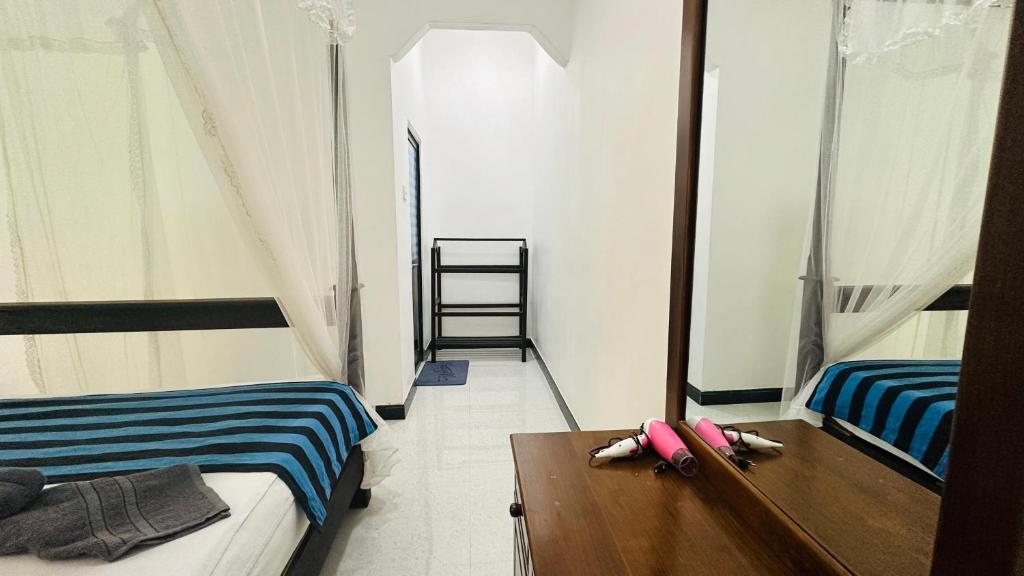 Postel nebo postele na pokoji v ubytování Sigiriya Danu Homestay