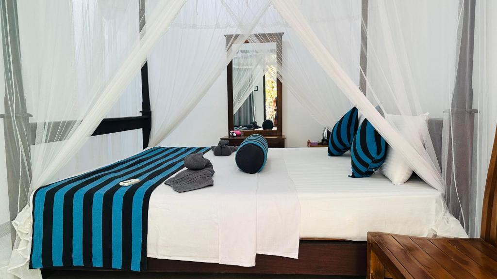 Postel nebo postele na pokoji v ubytování Sigiriya Danu Homestay
