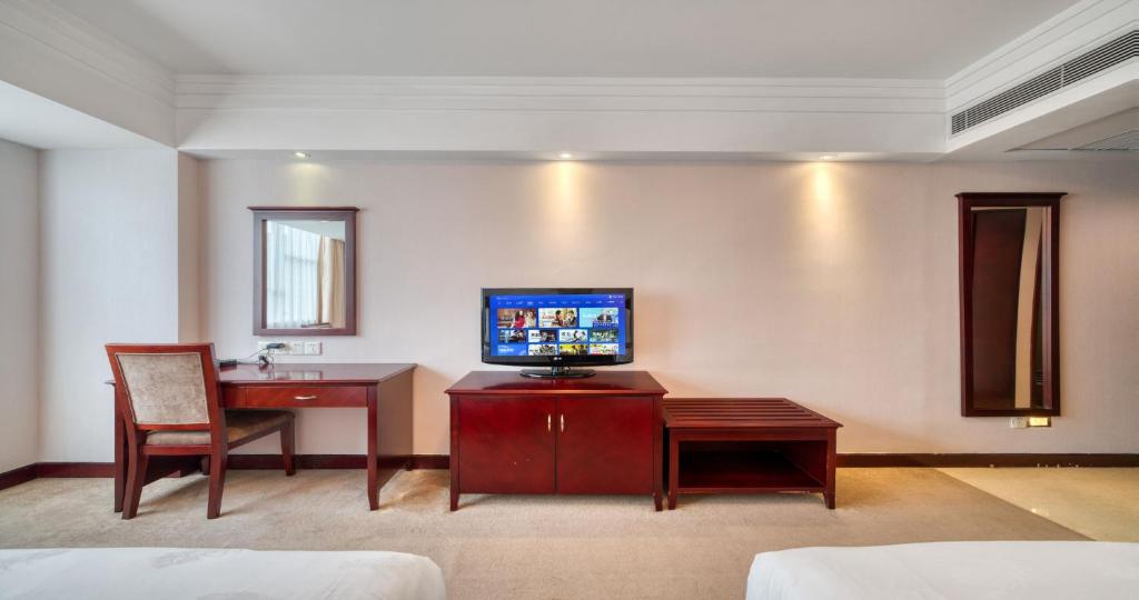 TV a/nebo společenská místnost v ubytování Sanyu Hotel
