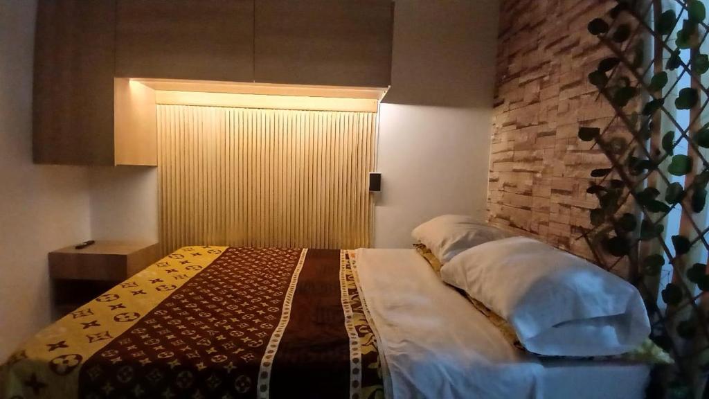 Postel nebo postele na pokoji v ubytování Apartaestudio Rionegro cerca Aeropuerto