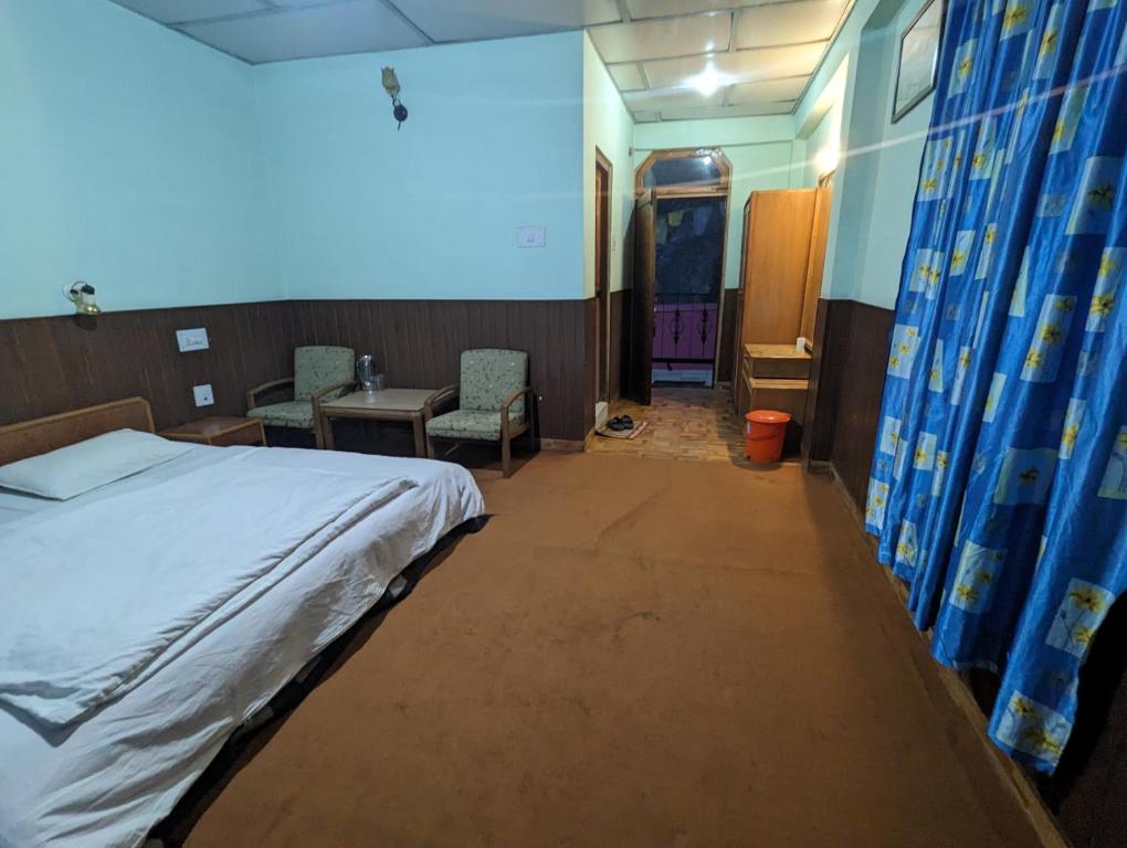 Postel nebo postele na pokoji v ubytování Hotel tashi deleg