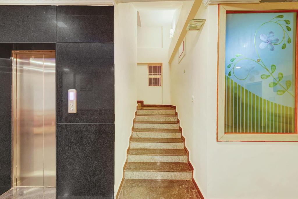 Fotografie z fotogalerie ubytování Super Townhouse Oak City Center Kushal Nagar v destinaci Kushalnagar