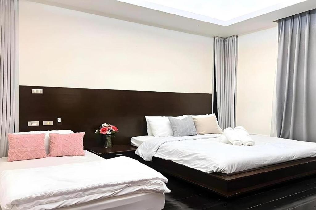 Postel nebo postele na pokoji v ubytování BM Pool Villa Pattaya