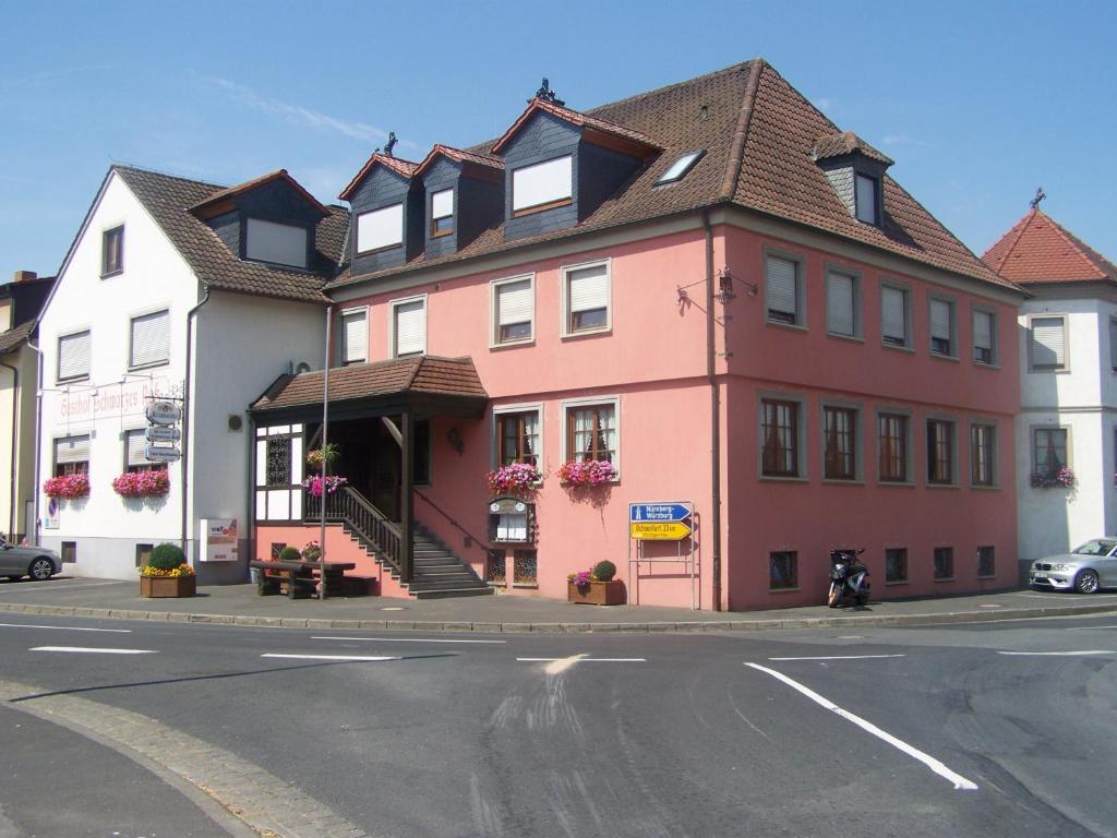 a building on the side of a street at Hotel Schwarzes Ross in Schwarzach am Main