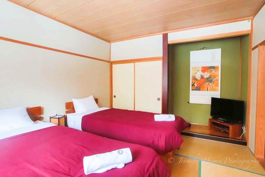 Postel nebo postele na pokoji v ubytování Morino Lodge - Hakuba