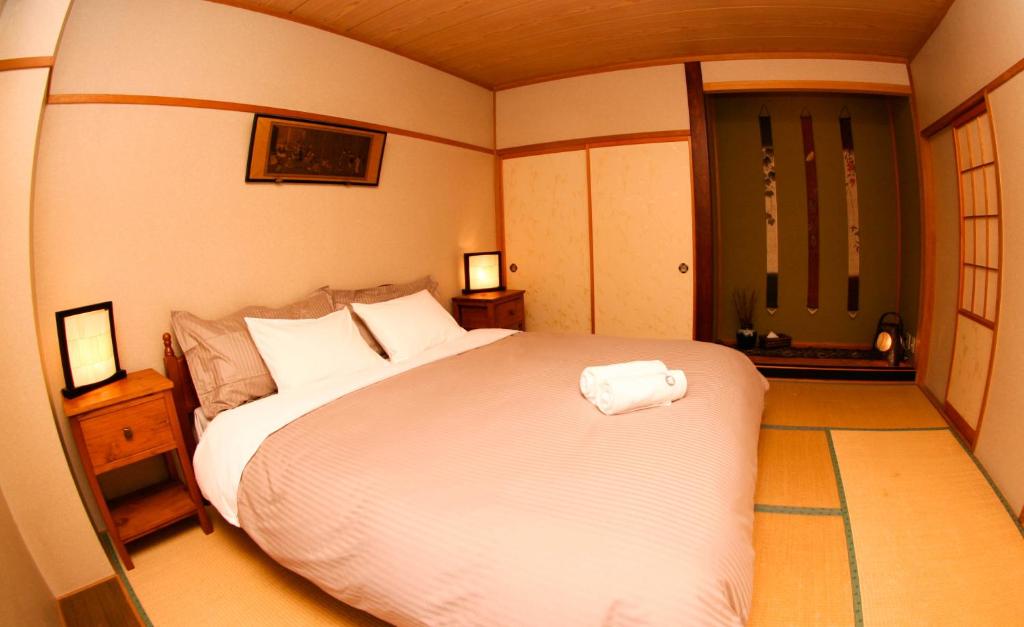 Postel nebo postele na pokoji v ubytování Morino Lodge - Hakuba